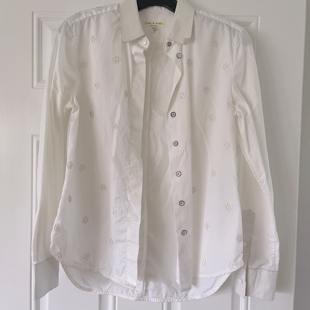 Leather detail on shirt and cuff. Great condition.